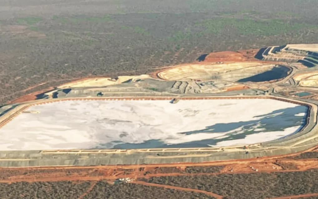 Aerial view of the Tropicana Gold Mine tailings storage facility, with the open pits and plant beyond in the Great Victoria Desert